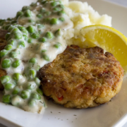 Salmon Cakes dish with creamed peas