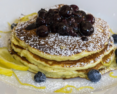 plated pancakes with blueberries